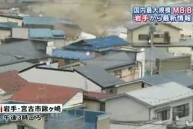 In video provided by Tokyo Broadcasting System, homes are seen being swept away by tsunami waves in the city Miyako, northeast of Sendai. 