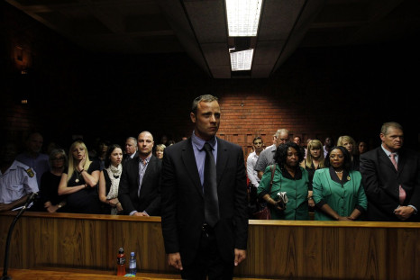 "Blade Runner" Oscar Pistorius awaits the start of court proceedings in the Pretoria Magistrates court February 19, 2013.