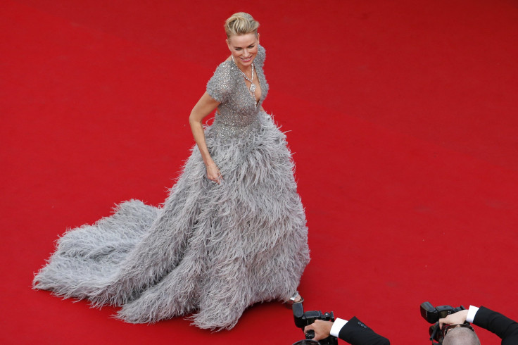 [14:40] Actress Julianne Moore poses on the red carpet as she arrives for the opening ceremony and the screening of the film "La tete haute" out of competition during the 68th Cannes Film Festival 