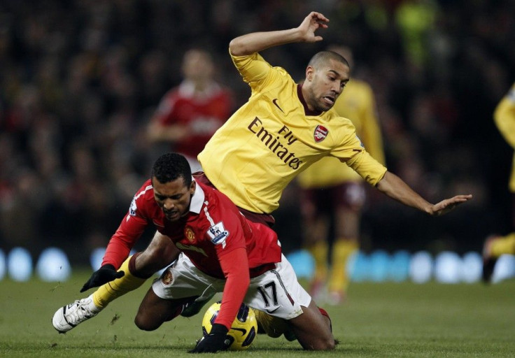 Arsenal's Clichy challenges Manchester United's Nani during their English Premier League soccer match at Old Trafford in Manchester.