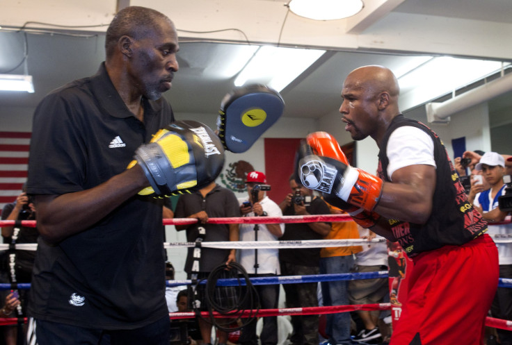 Roger Mayweather with Floyd Mayweather Jr.