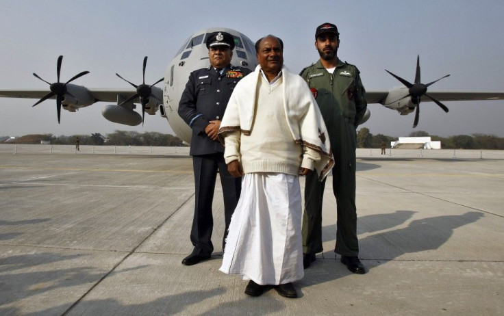 India's Defence Minister Antony, India's Air Chief Marshal Naik and Singh, an Air Force official, pose in front of the Super Hercules aircraft at Hindan