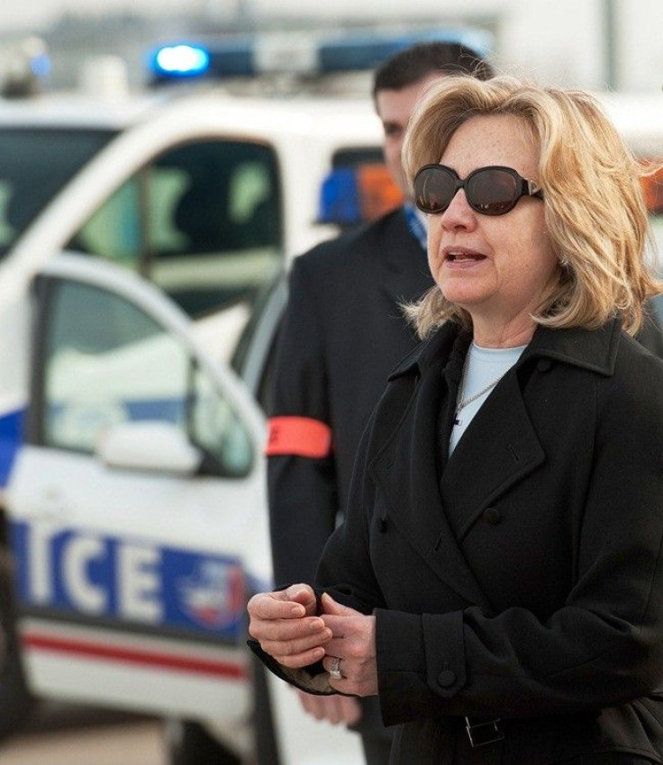U.S. Secretary of State Hillary Clinton walks as she arrives at Le Bourget Airport, northern Paris, March 14, 2011 to attend a Group of Eight foreign ministers meeting in Paris on the unrest in Libya.