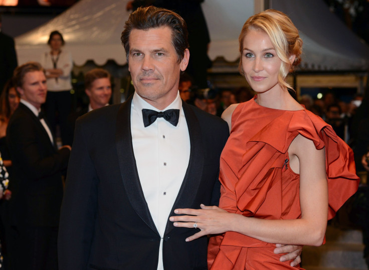[9:39] Cast member Josh Brolin (L) and his girlfriend Kathryn Boyd pose on the red carpet as they leave after the screening of the film "Sicario"