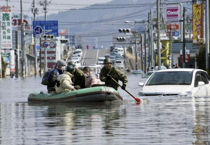 Japan Self Defence Forces troops rescue people from flooded areas in Ishimaki City, Miyagi Prefecture