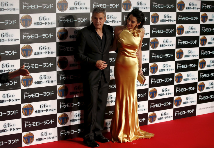  Cast member George Clooney (L) poses with his wife Amal on the red carpet during the Japan premiere of the movie "Tomorrowland" in Tokyo 