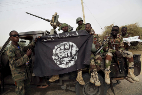 Nigerian soldiers hold Boko Haram flag