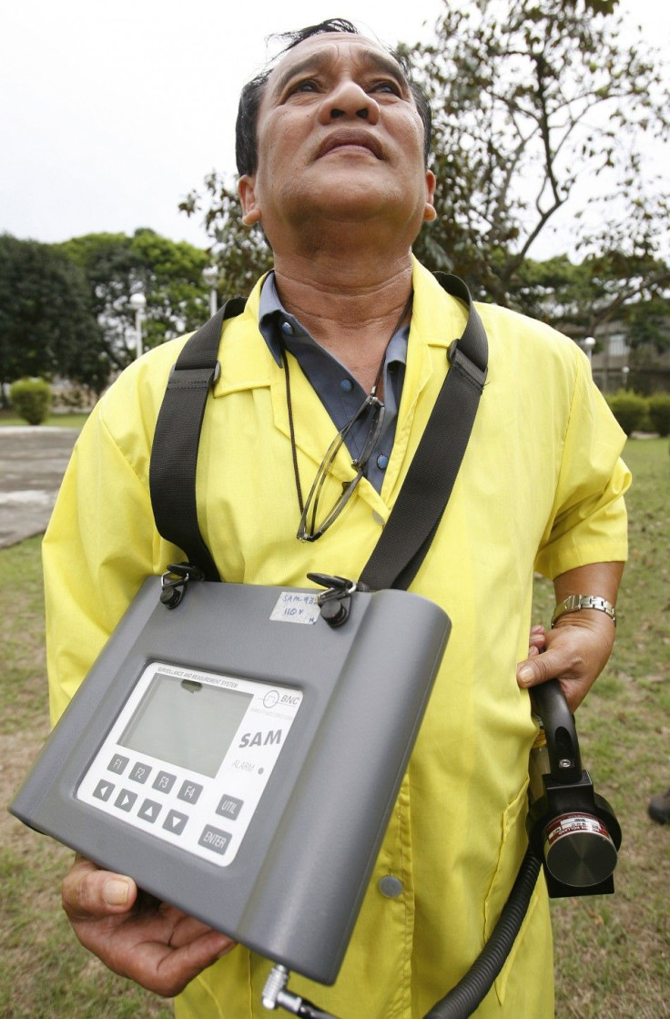 A Nuclear Research Bureau staff member from the PNRI monitor radiation levels in the air in Quezon City