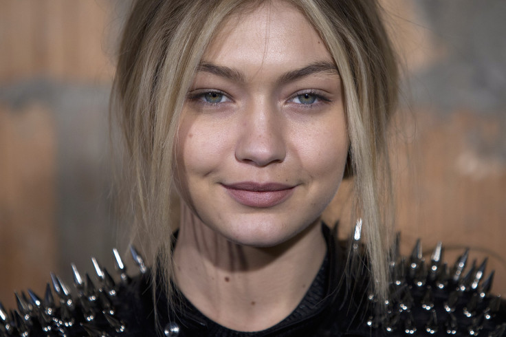 [8:09] Model Gigi Hadid poses for a photo before the Diesel Black Gold Fall/Winter 2015 collection show during New York Fashion Week
