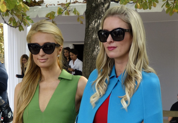 [12:29] Socialites Paris (L) and Nicky Hilton pose after the Valentino Spring/Summer 2015 women's ready-to-wear collection show during Paris Fashion Week 