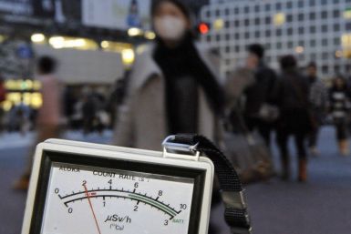 A radiation dosimeter indicates 0.6 microsieverts in Shibuya, Tokyo