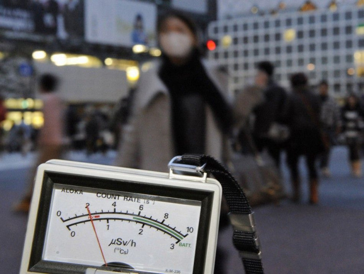 A radiation dosimeter indicates 0.6 microsieverts in Shibuya, Tokyo