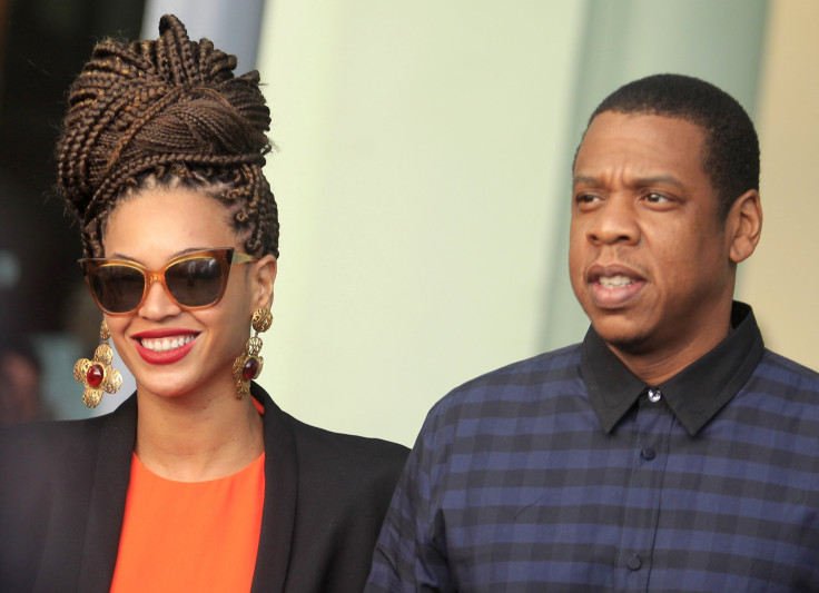[7:50] U.S. singer Beyonce (L) and her husband rapper Jay-Z walk as they leave their hotel in Havana