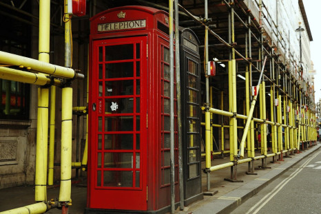 Telephone boxes are surrounded by scaffolding at a construction site in central London September 2, 2014.