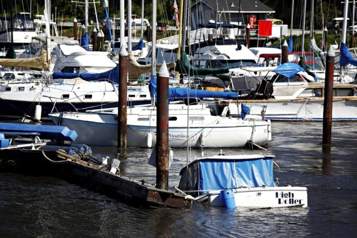 A boat begins to take in water and sink at the Santa Cruz Harbor in Santa Cruz, California