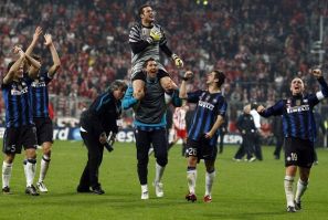 Cesar, goalkeeper of Inter Milan celebrates with team mates after the second leg round of sixteen Champions League soccer match against Bayern in Munich.