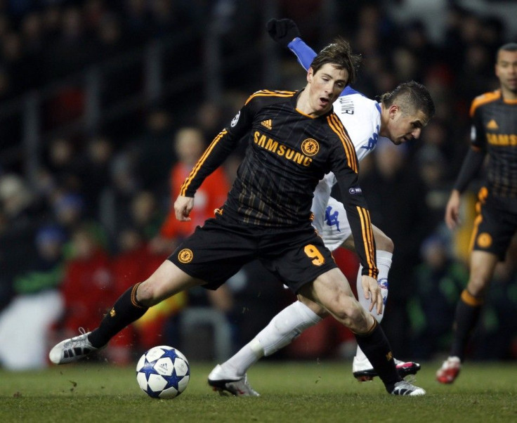 FC Copenhagen's Claudemir challenges Chelsea's Torres during their Champions League soccer match at Parken stadium in Copenhagen.