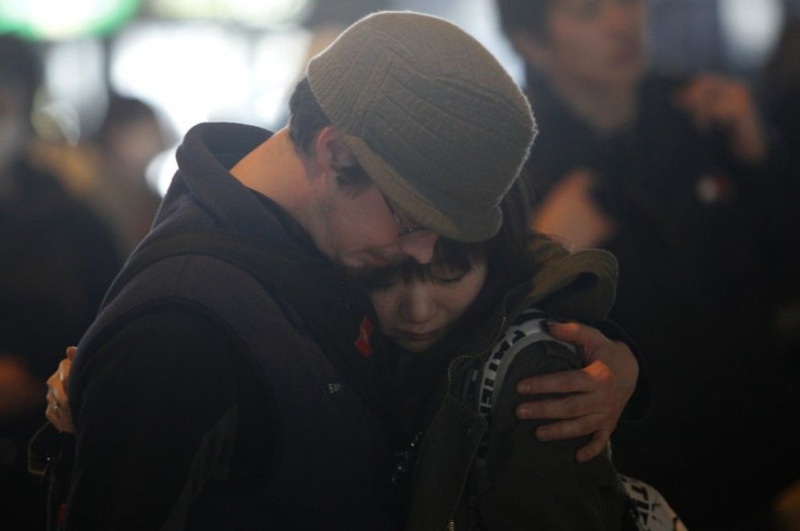 Couple hugs each other before one of the pair will board a flight at Narita International Airport in Narita