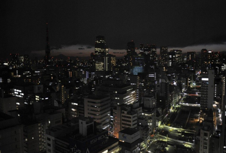 Lights are turned off to save energy before rolling blackouts in Tokyo