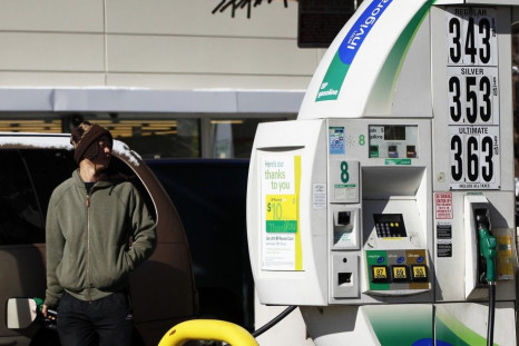 A man pumps gas into his vehicle at a petrol station in New York