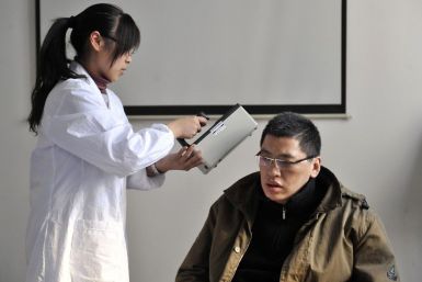 A man who just returned from Sendai gets checked for radiation levels at a research laboratory of Fudan University in Shanghai