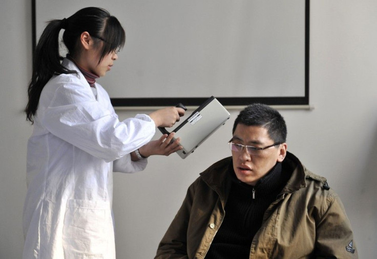 A man who just returned from Sendai gets checked for radiation levels at a research laboratory of Fudan University in Shanghai