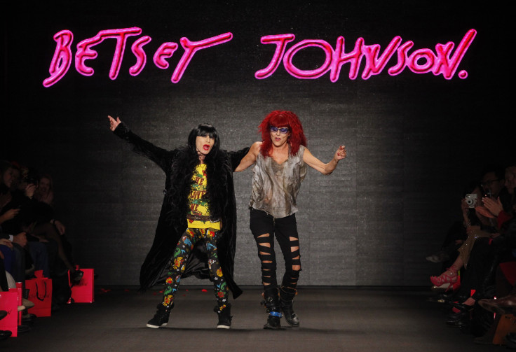 [12:07] Designers Betsey Johnson (L) and Patricia Field dance on the runway after Johnson's Fall/Winter 2011 collection show