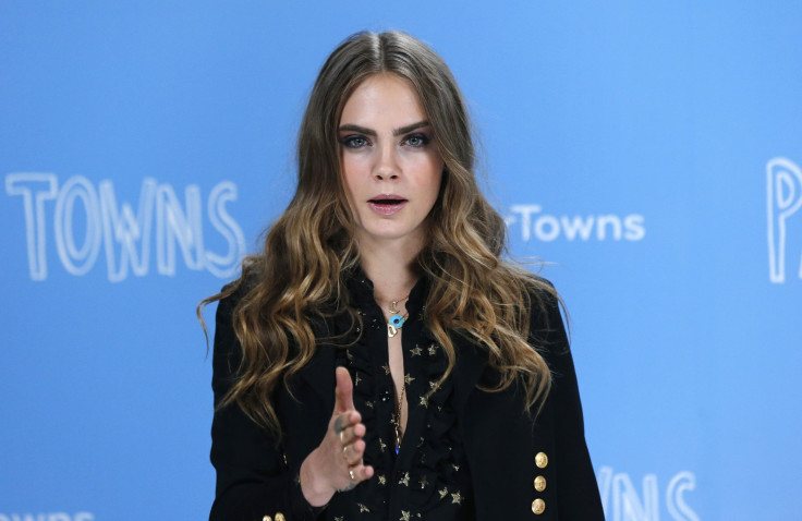 [11:23] Cast member Cara Delevingne poses for photos at a photo call promoting her film 'Paper Towns' at Claridges in London
