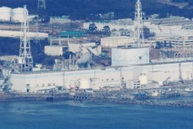 Japan hopes to restore power at two crippled reactors Friday