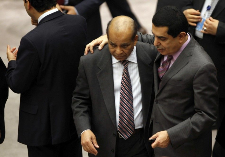 Libyan Ambassador to the UN Abdurrahman Mohamed Shalgham is greeted by an unidentified diplomat before the start of a Security Council Meeting in New York.