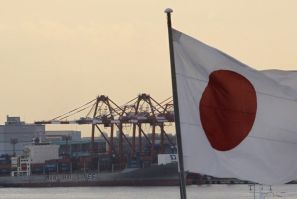 Japan's national flag is seen at an industrial port in Tokyo