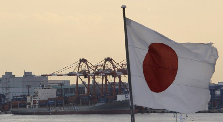 Japan's national flag is seen at an industrial port in Tokyo