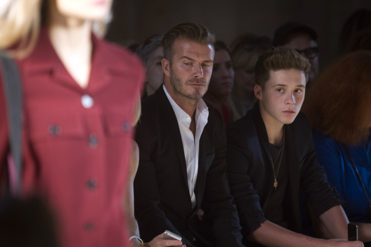 [9:53] David Beckham and his son Brooklyn Beckham watch a model present a creation during the Victoria Beckham Spring/Summer 2015 collection during New York Fashion Week