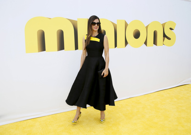 [10:08] Actress Sandra Bullock poses at the premiere of the film "Minions," in Los Angeles