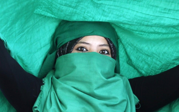 A woman attends a rally in support of Libya's leader Muammar Gaddafi in Tripoli
