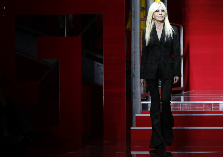 [8:23] Italian designer Donatella Versace acknowledges the applause at the end of Versace Autumn/Winter 2015 /16 collection during Milan Fashion Week