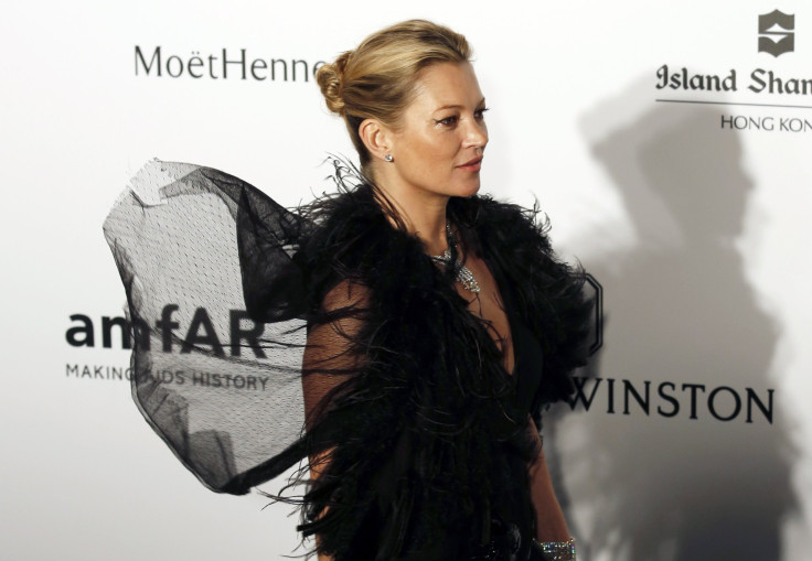 [8:38] British model Kate Moss poses upon arrival at the Foundation for AIDS Research's (amfAR) inaugural fundraising gala in Hong Kong