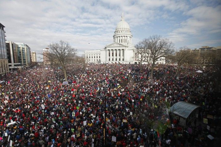 Massive crowds gather to see 14 democratic senators that left state to protest bill proposed by Gov. Walker as crowds continued to protest at the Wisconsin State Capitol in Madison