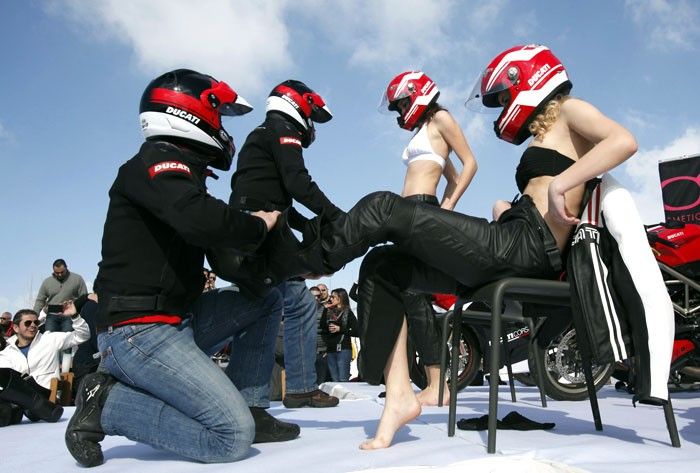 Bikers undress models wearing Ducati suits during the K-Lynn lingerie fashion show in Faqra