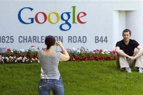 Man has his picture taken in front of Google Inc. headquarters in Mountain View