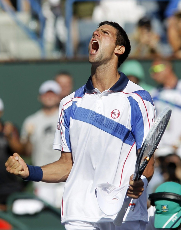 Novak Djokovic of Serbia celebrates after defeating Roger Federer of Switzerland in their semifinal match at the Indian Wells ATP tennis tournament in Indian Wells.