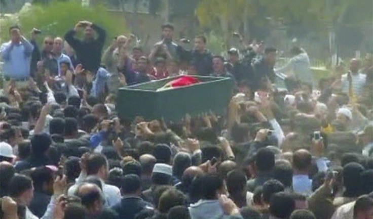 Frame grab of a crowd chanting anti-regime slogans during a funeral procession for a protester killed in Dara