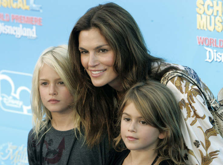 [8:31] Model Cindy Crawford poses with her children son Presley (L) and daughter Kaia at the premiere of the Disney Channel movie "High School Musical 2" at Downtown Disney in Anaheim