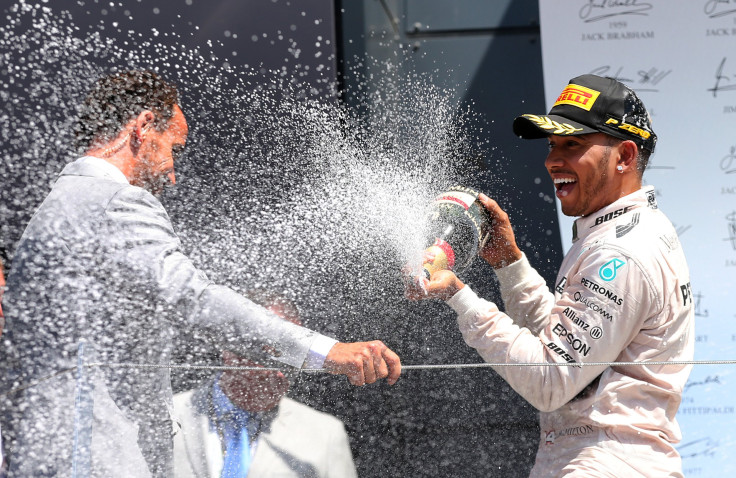 [9:01] Formula One racer Lewis Hamilton celebrates his win in the Mercedes' British Grand Prix 2015 on the podium with champagne at Silverstone