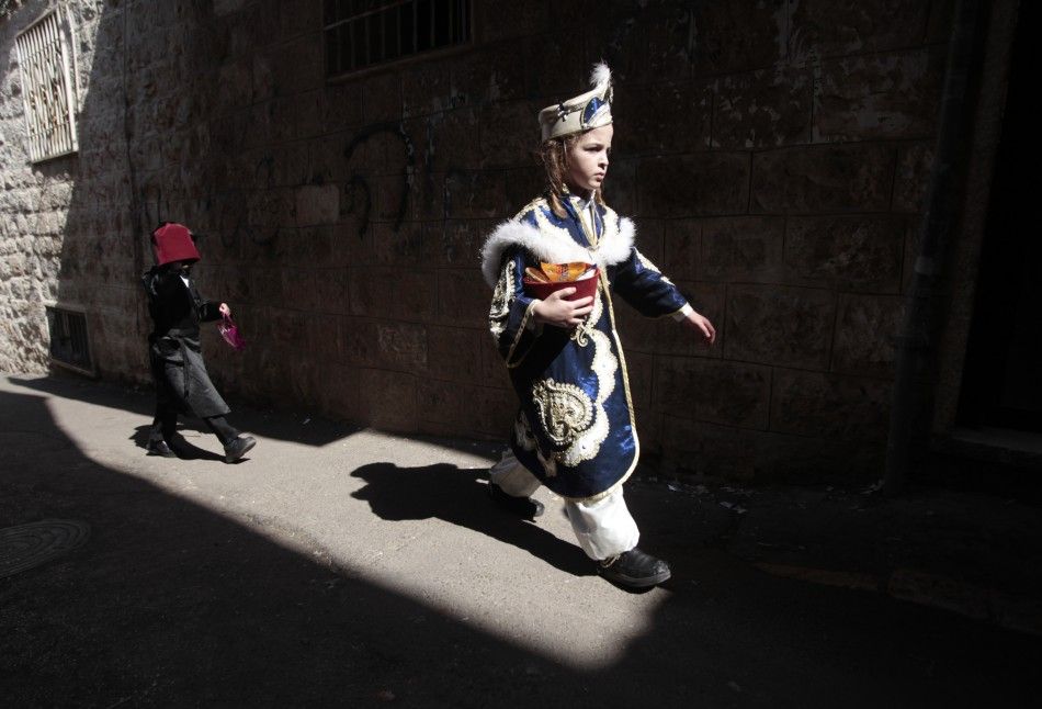 Ultra-Orthodox Jewish boys wear costumes during celebrations for the Jewish holiday of Purim in Jerusalems Mea Shearim neighbourhood