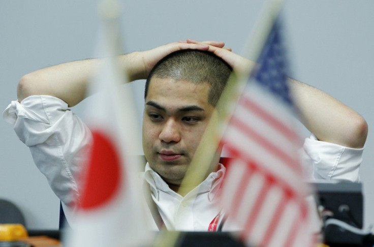 A foreign exchange dealer works at a trading room of a foreign exchange trading company in Tokyo