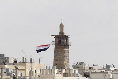 A Syrian flag flutters from the minaret of Omari mosque at the old city of Deraa March 22, 2011.