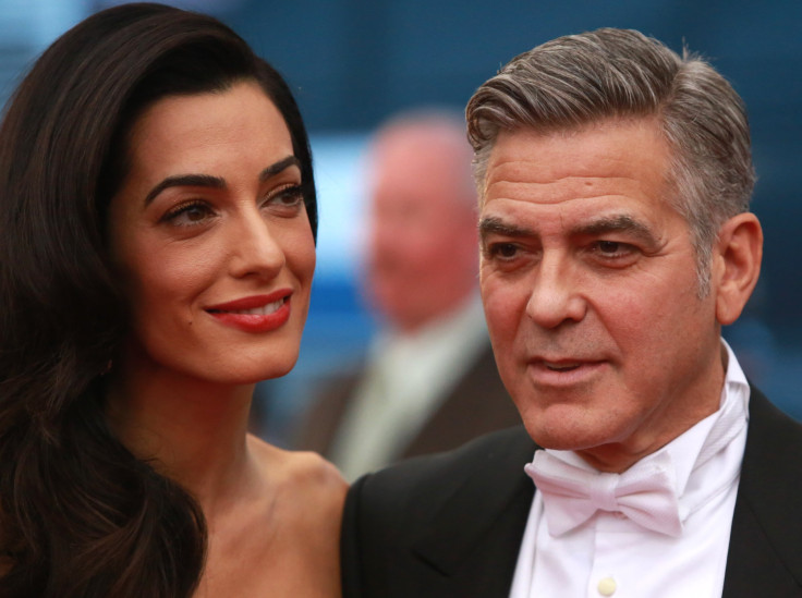 [11:34] U.S. actor George Clooney arrives with his wife, Lebanese-British lawyer Amal Ramzi Clooney