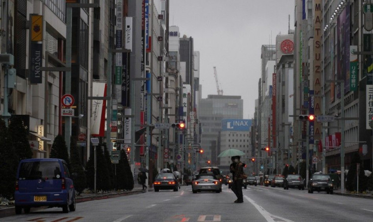 Pedestrians cross a street in Tokyo's Ginza shopping district