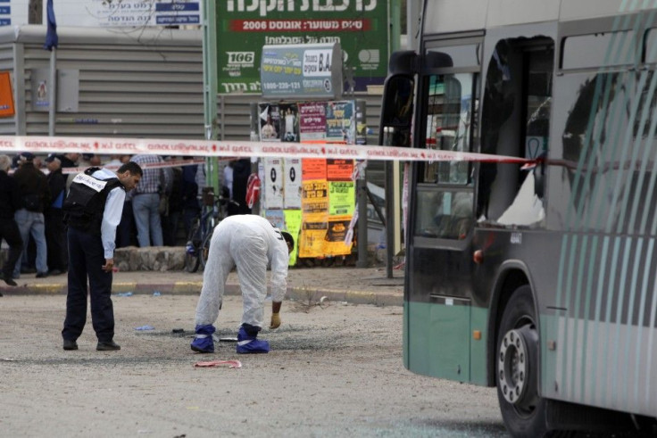 An Israeli police explosives expert surveys the scene of an explosion in Jerusalem